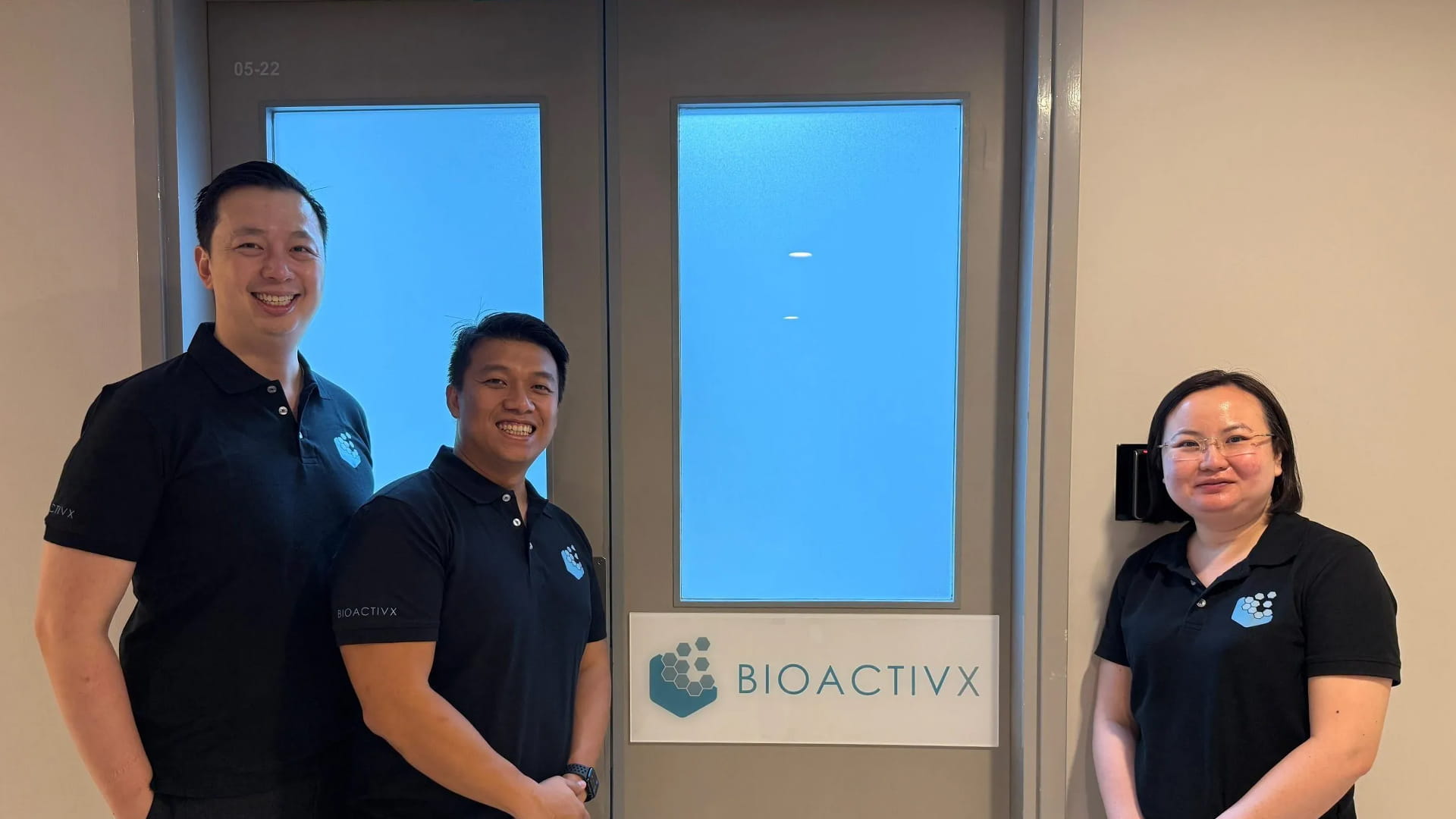 Bioactivx co-founders Yew Lok, Mickey Cheong, and Peili Teo at their office door.