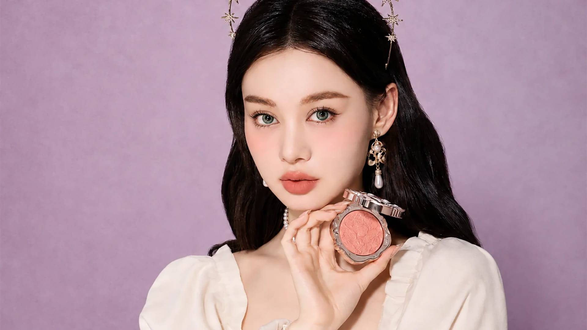 A model presenting Flower Knows' Little Angel Cream Blush from the Strawberry Rococo line.