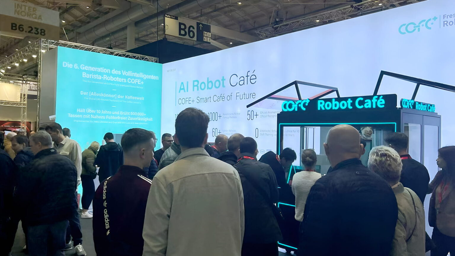 Visitors at Hi-Dolphin's Cofe+ Robot Cafe booth at the National Restaurant Association Show in Chicago 2026.