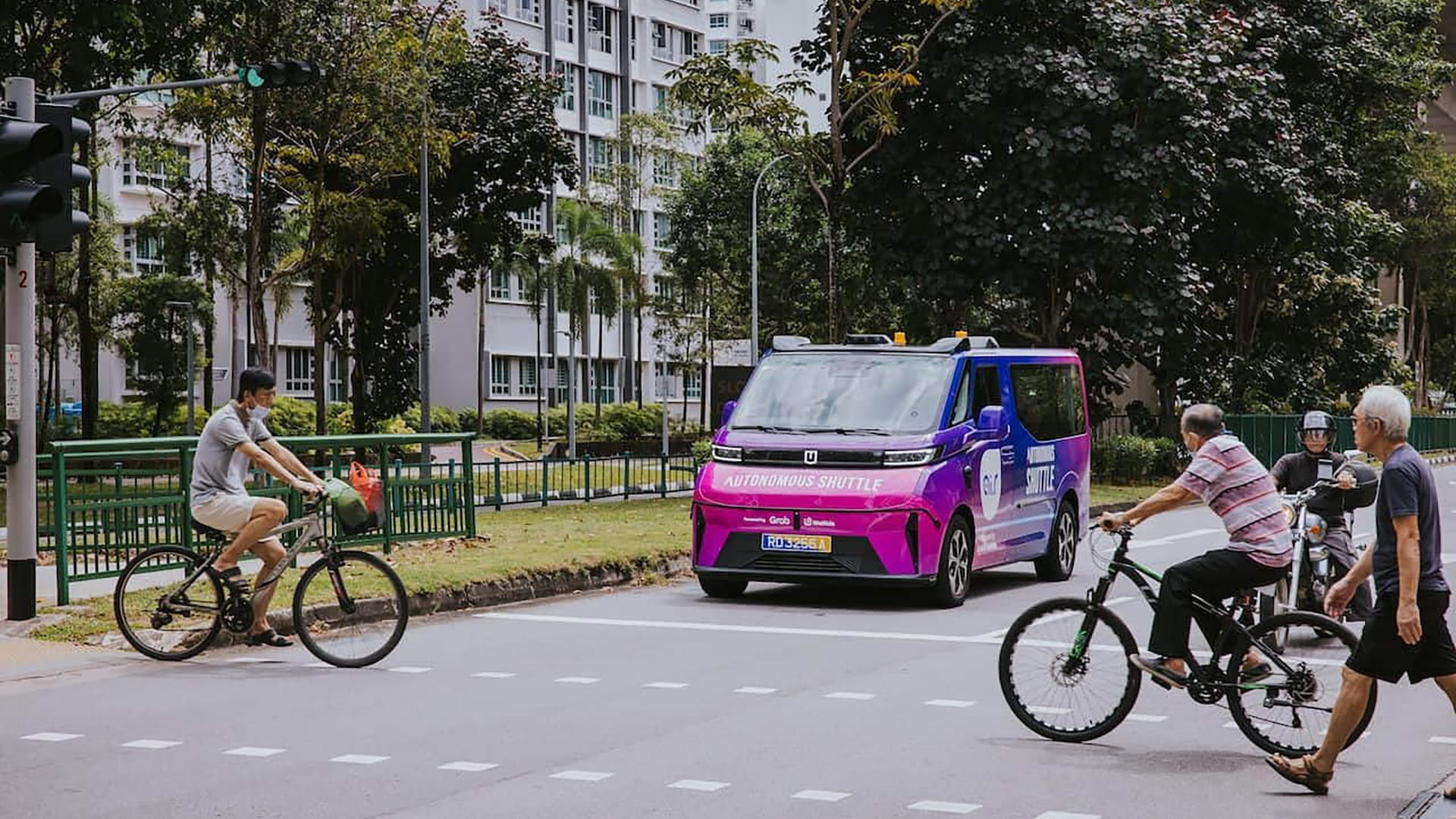A purple driverless van just started giving free rides in Punggol. The Singapore government put a state minister at the pickup point. The Malaysian transport operator should be reading what Singapore just decided.